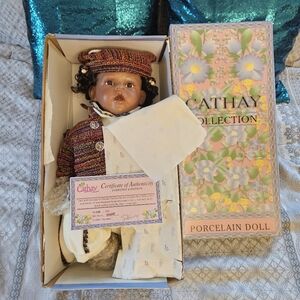 Porcelain Doll with Multicolor Outfit